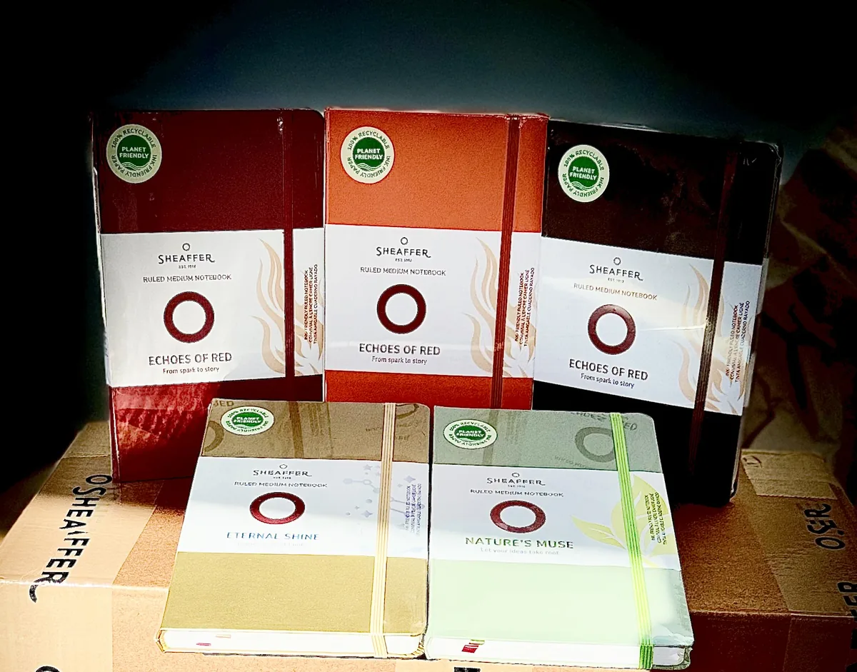 Sheaffer ruled notebooks with red, orange, pale green and cream covers